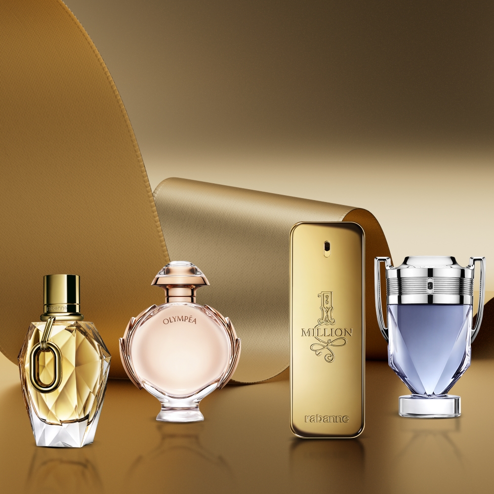 Rabanne Million Gold For Her, Olympea, 1 Million and Invictus perfumes displayed against a gold background.