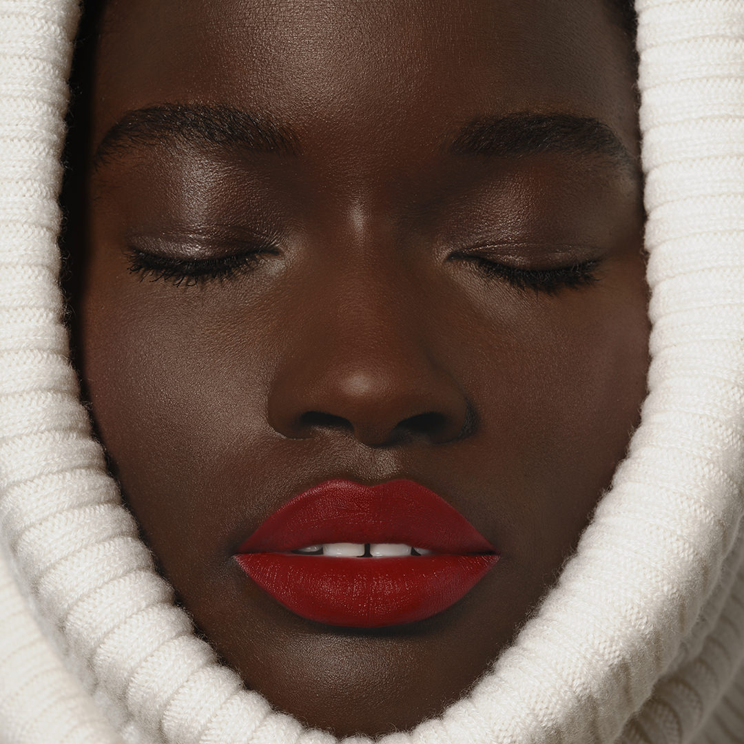 Black model wearing Sisley Phyto-Rouge Velvet Lipstick
