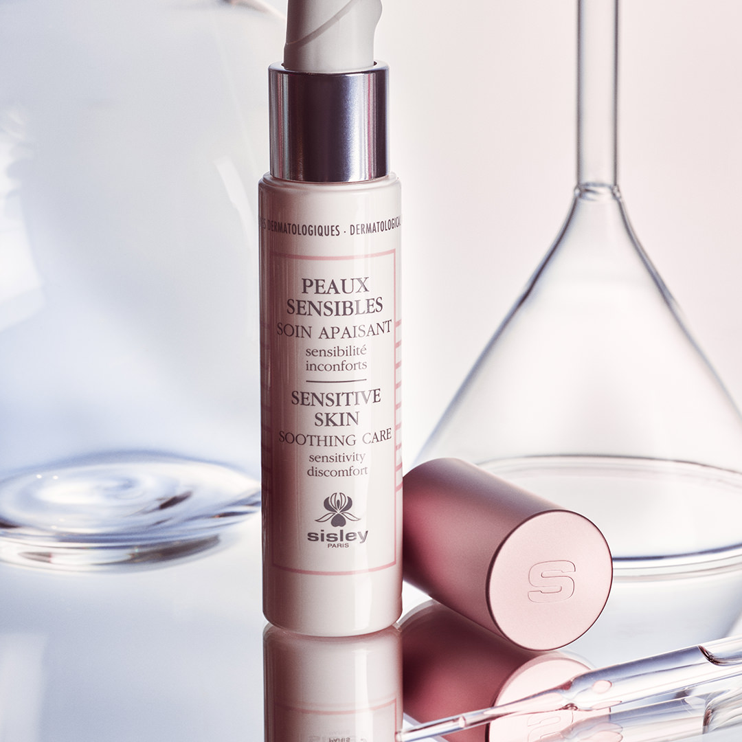 Sisley Sensitive Skin Soothing Care with lab glassware in background