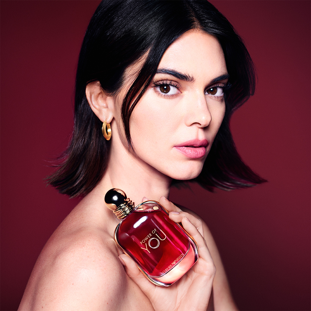 Female model holding Armani Power of You perfume.